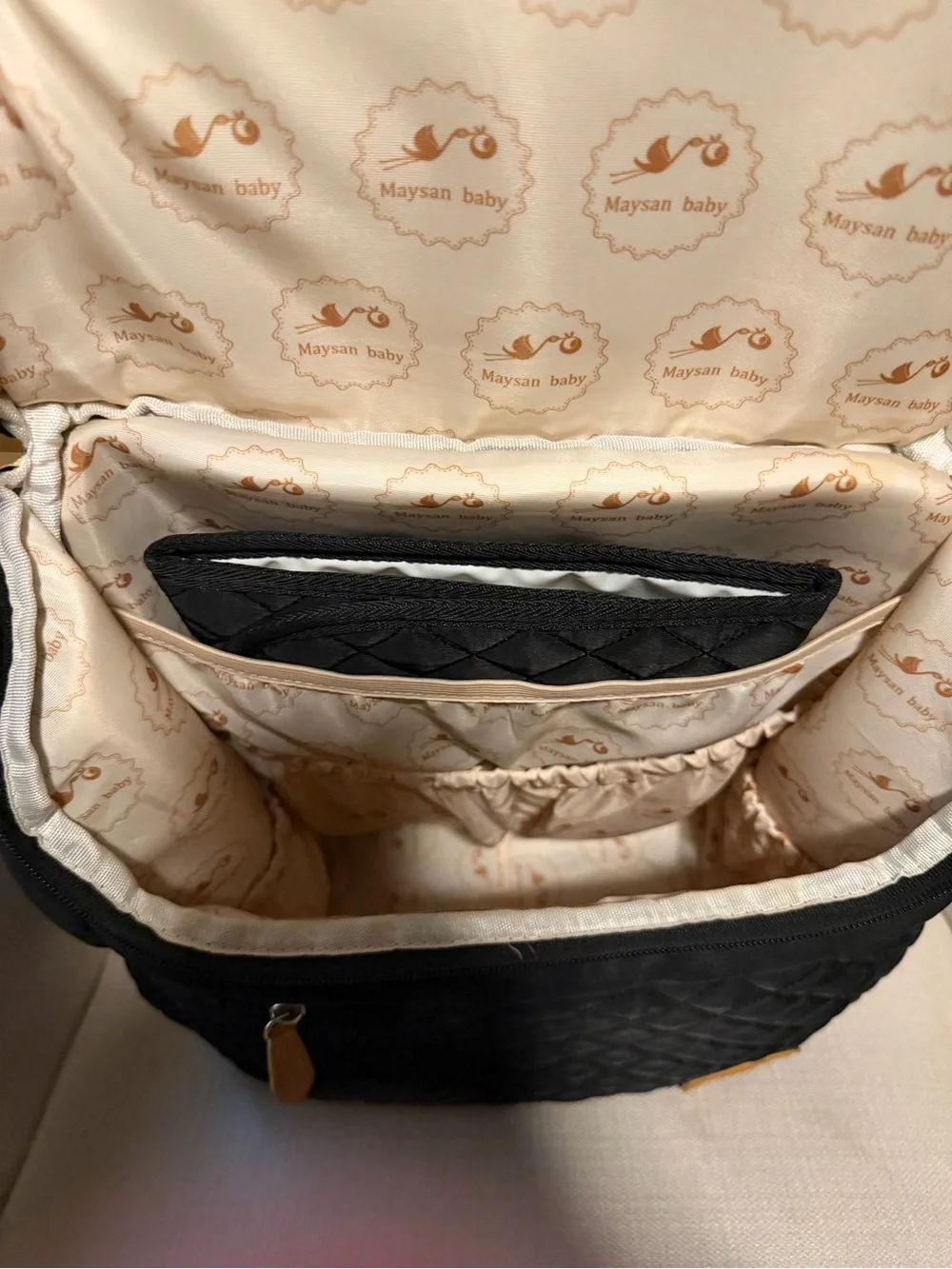 Quilted Black Women's Backpack with Tan Trim Accents